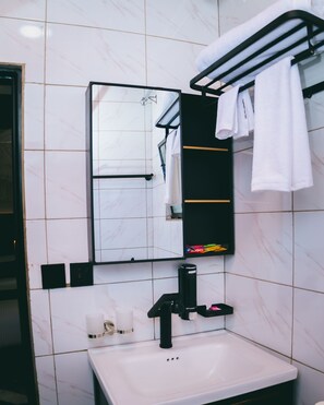 Shower, free toiletries, hair dryer, slippers