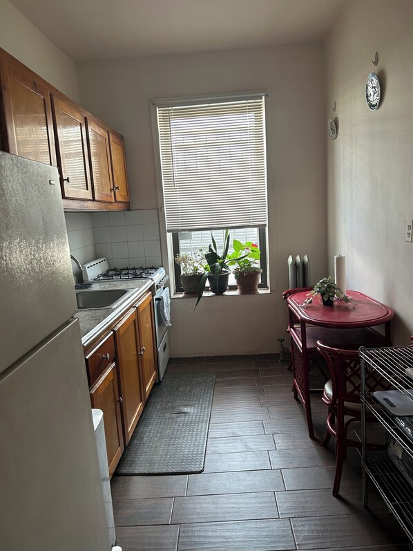Fridge, microwave, stovetop, coffee/tea maker