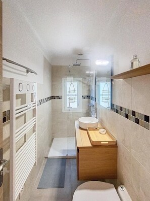 Shower, hair dryer, towels, soap