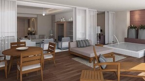 A modern living room with a wooden dining table, sofa, and a small pool area. - 3-Bedroom Vidanta Grand Luxxe (Nuevo Nayarit)