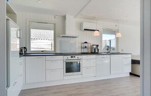 Fridge, stovetop, dishwasher, coffee/tea maker