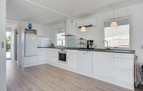 Fridge, stovetop, dishwasher, coffee/tea maker