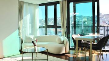 Design Apartment, 2 Bedrooms, City View | Living area | Smart TV, computer monitors