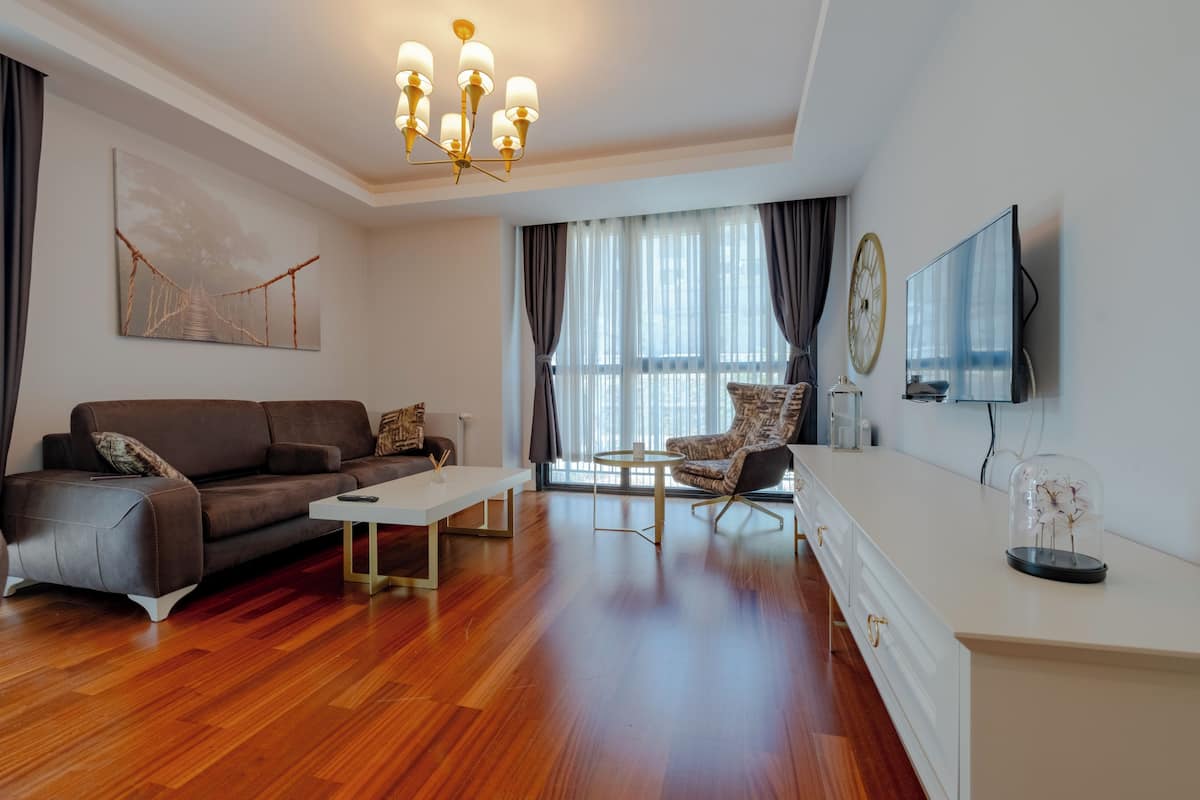 Deluxe Apartment, 1 Bedroom, Balcony | Living area | Smart TV, computer monitors