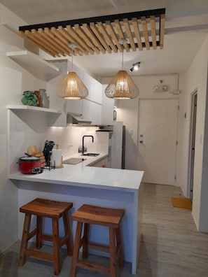 Fridge, microwave, stovetop, coffee/tea maker