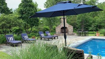 Seasonal outdoor pool, open 8:00 AM to 8:00 PM, pool umbrellas