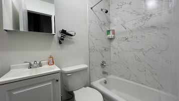 Hair dryer, towels, soap, shampoo