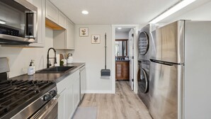 A modern kitchen with stainless steel appliances, a gas stove, and a built-in oven. - Charming barndominium with children's loft in quaint Middleton, Idaho (Caldwell)