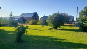 A rural landscape with a barn and open fields. -  Authentic pioneer 
2 bedroom ranch farmhouse in beautiful Teton Valley Idaho. (Victor)