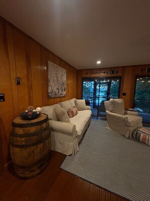 Smart TV, fireplace, books, computer monitors