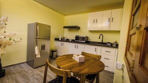 Fridge, microwave, stovetop, coffee/tea maker