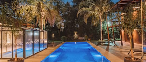 Indoor pool, outdoor pool, pool umbrellas, pool loungers