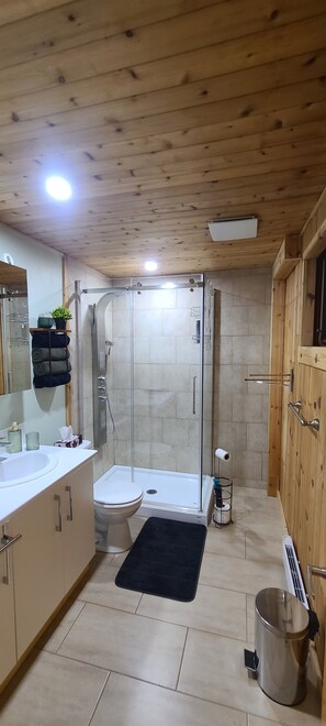 Shower, eco-friendly toiletries, towels, soap