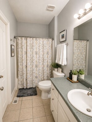 Jetted bath, hair dryer, towels, soap