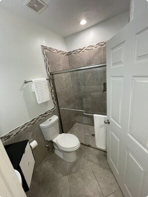 Shower, hair dryer, towels, soap