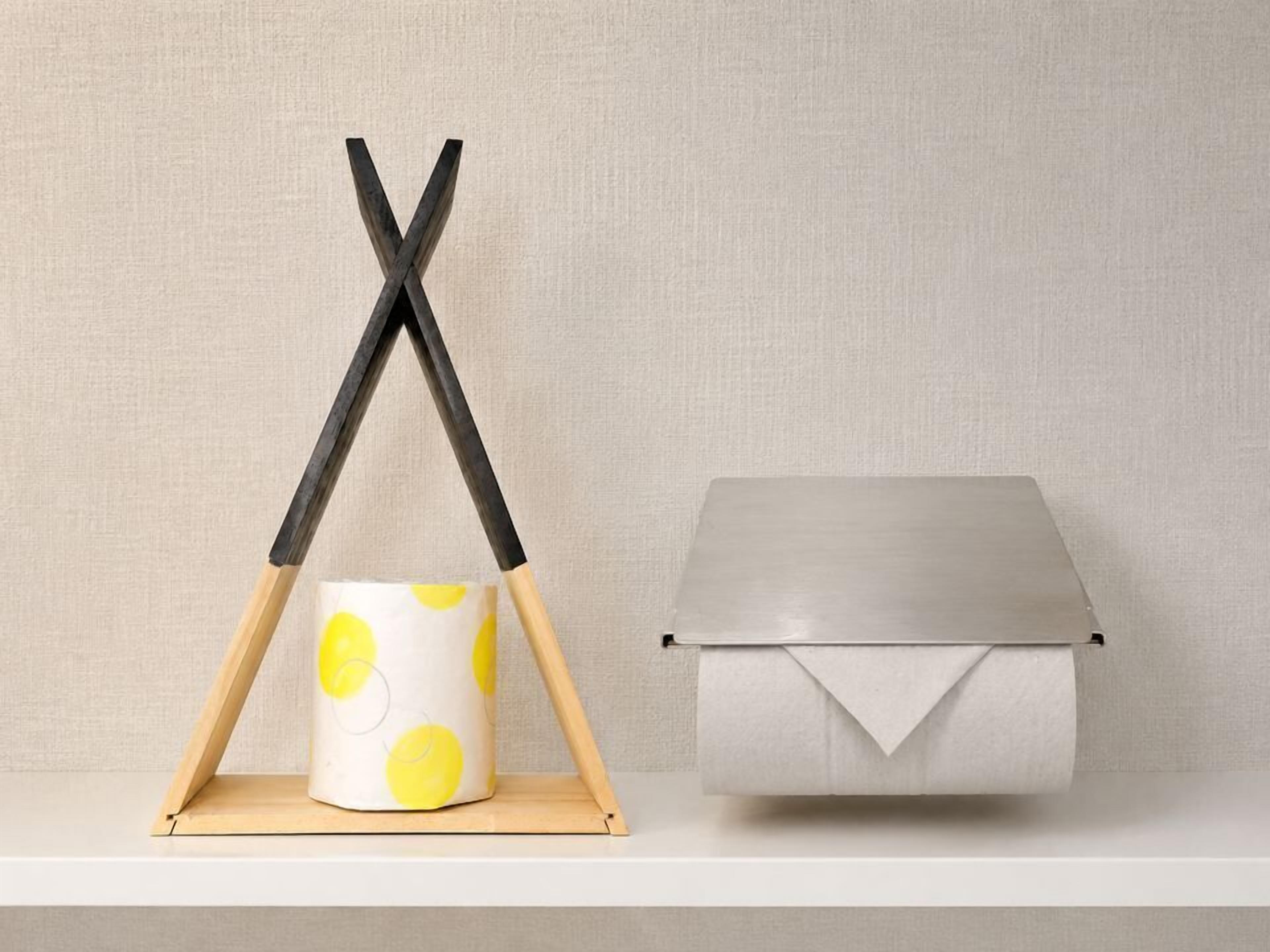 A white shelf with a white container with a lid and a white container with a lid.