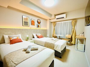 Classic Twin Room | Premium bedding, desk, laptop workspace, blackout drapes