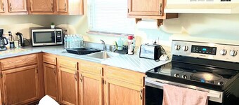 Large and neatly arranged house with a large parking lot .