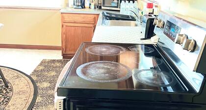 Large and neatly arranged house with a large parking lot .