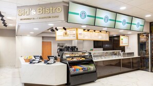 A Starbucks coffee shop with a counter, menu boards, and a display case with pastries. - Charming villa with WiFi, AC, fitness room in fabulous Orlando (Orlando)