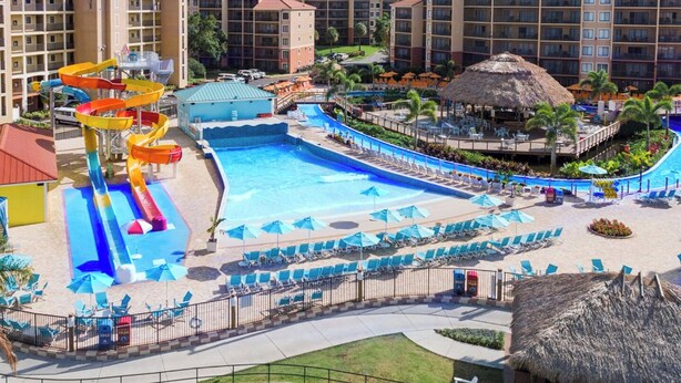 A resort with a large pool, water slides, and multiple buildings with balconies. - Charming villa with WiFi, AC, fitness room in fabulous Orlando (Orlando)