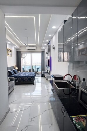 Luxury Studio Suite, 1 Bedroom, City View | Living area | 32-inch LCD TV with digital channels