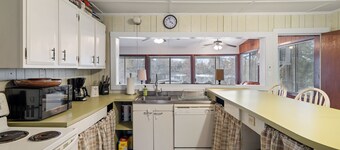 TWO homes on Black River Lake with TWO boat slips!