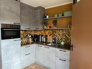Private kitchen - Spacious Apartment in Maartenszee Dune (Sint Maartensvlotbrug)