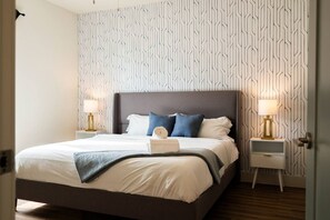 1 bedroom, desk, iron/ironing board, travel crib