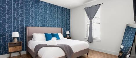 1 bedroom, desk, iron/ironing board, travel crib