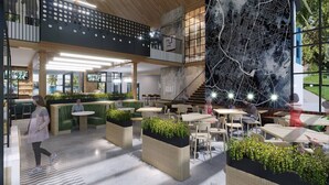 A spacious indoor area with multiple seating arrangements, including tables and benches, and a large wall mural. - Perfect Spot: Cozy Stay & Coffee Shop/Bar Onsite! (Pflugerville)