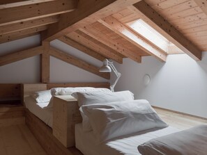 Deluxe Quadruple Room | Minibar, in-room safe, desk, laptop workspace