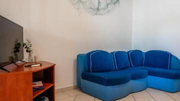 Apartment (Two Bedroom Apartment 1) | Living room | 32-inch flat-screen TV with satellite channels