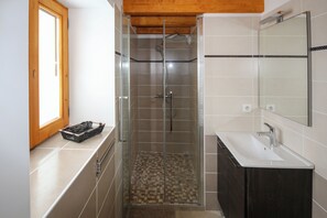 Shower, hair dryer, towels, toilet paper
