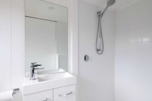 Shower, towels, soap, toilet paper