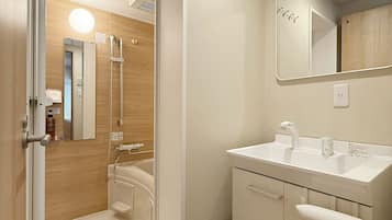 Hair dryer, slippers, towels, soap