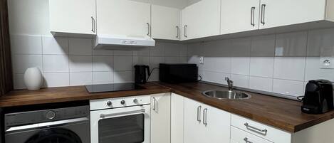 Microwave, coffee/tea maker, cookware/dishes/utensils