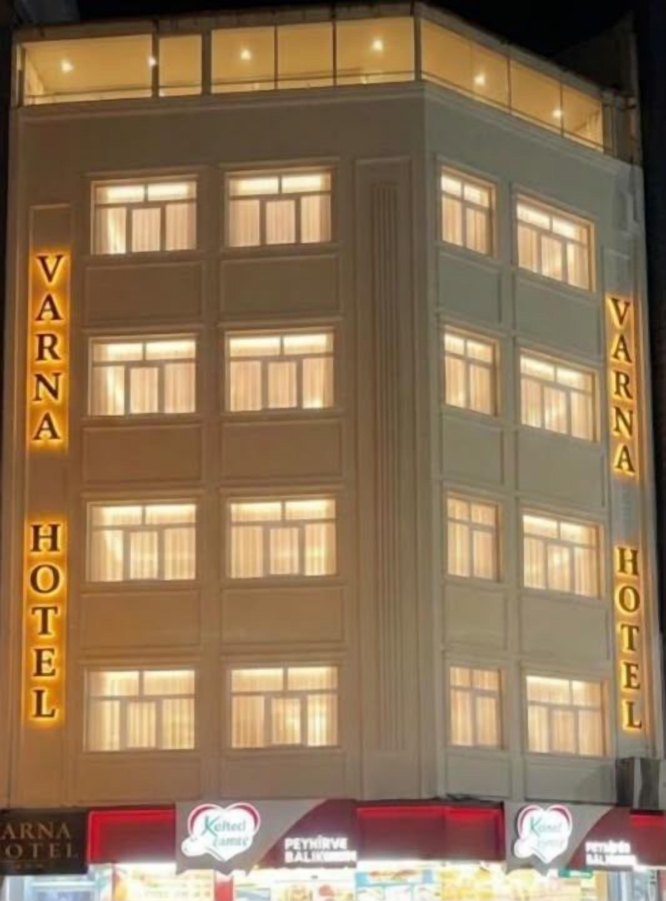 A multi-story hotel with a prominent sign reading 'VARNA HOTEL' on the facade.