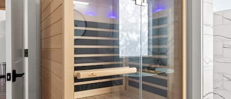 Un sauna moderne doté d’une paroi en verre, de lambris en bois et d’un panneau de commande.