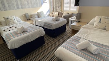 Family Triple Room | Premium bedding, iron/ironing board, free WiFi, bed sheets