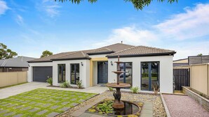 A modern house with a patio, a fountain, and a small garden. - The Canadian Escape, Ballarat - Up to 10 guests! (Canadian)