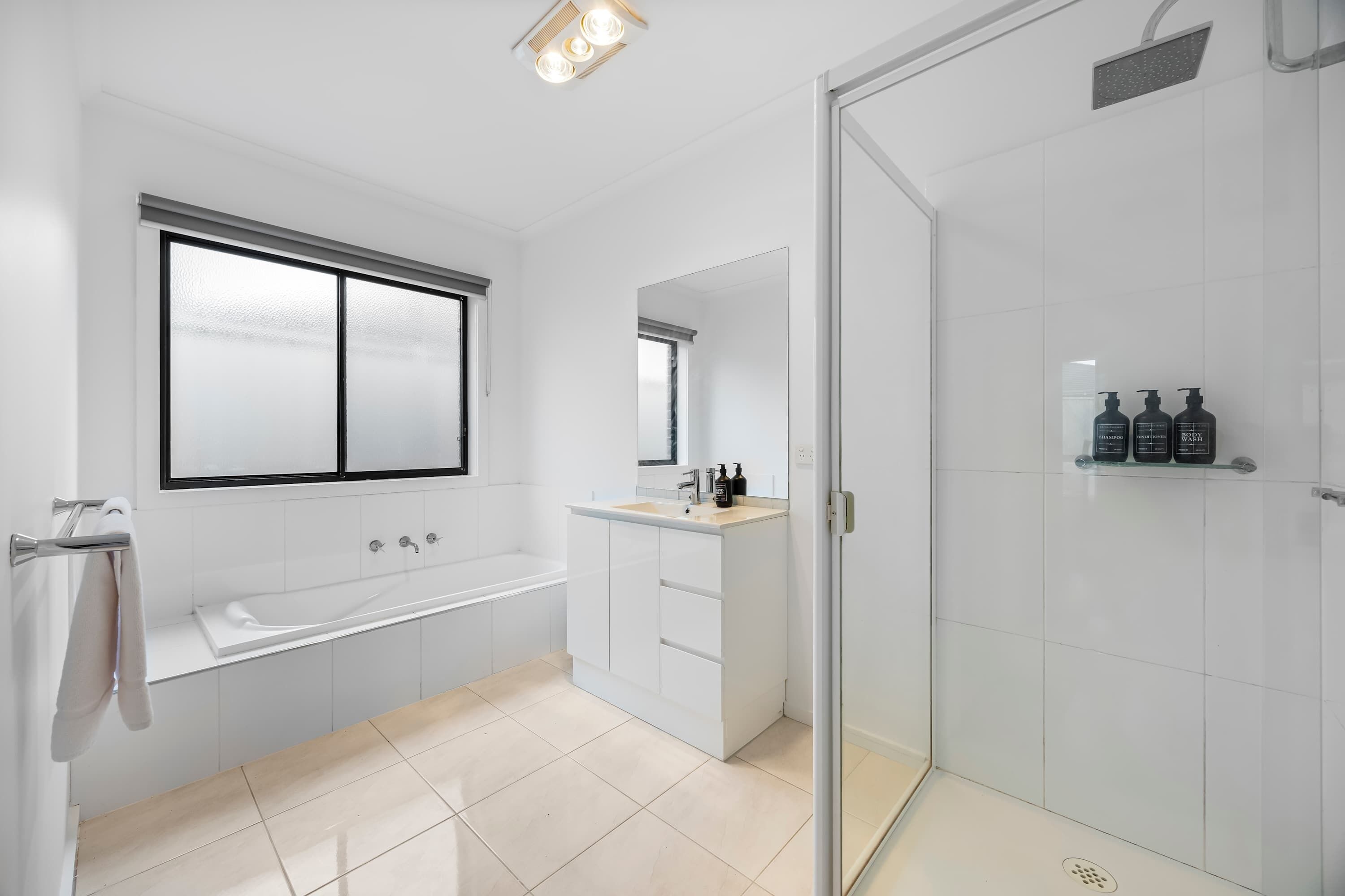 Shower, hair dryer, towels, shampoo