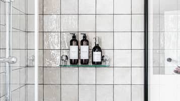 Shower, hair dryer, towels, shampoo