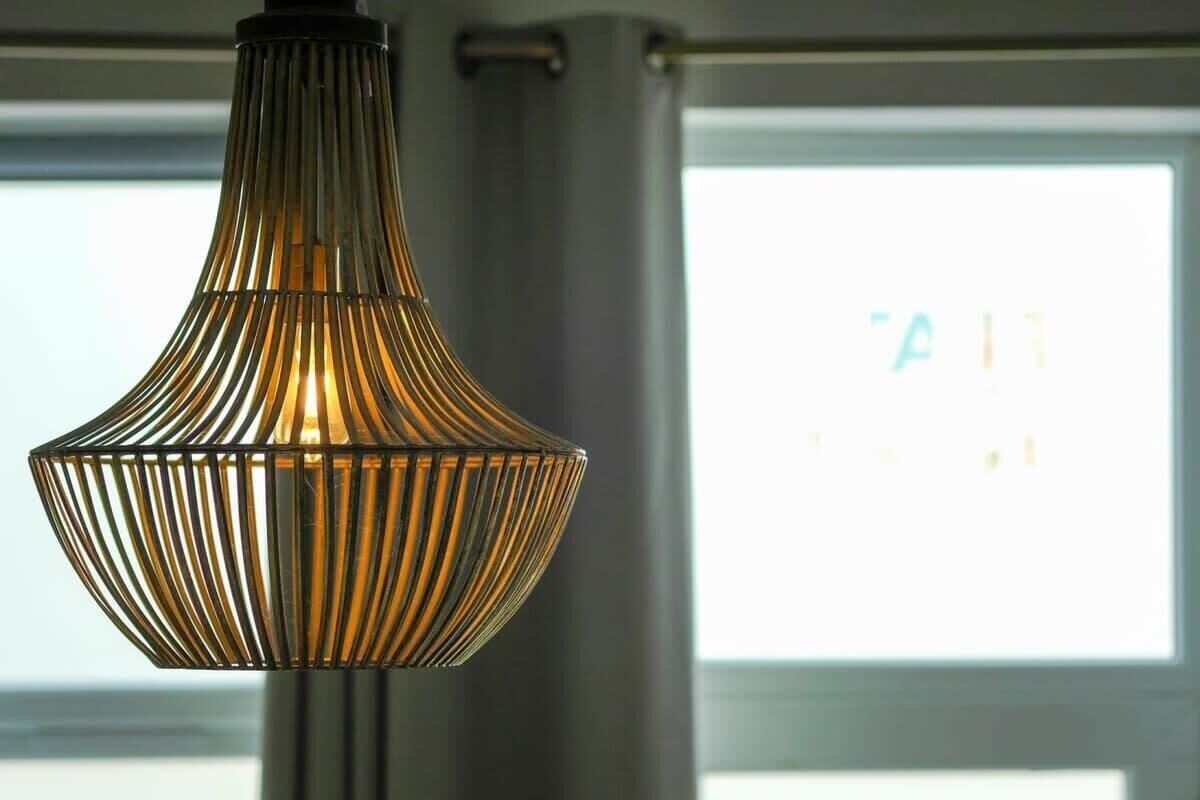 A hanging pendant light with a ribbed design.