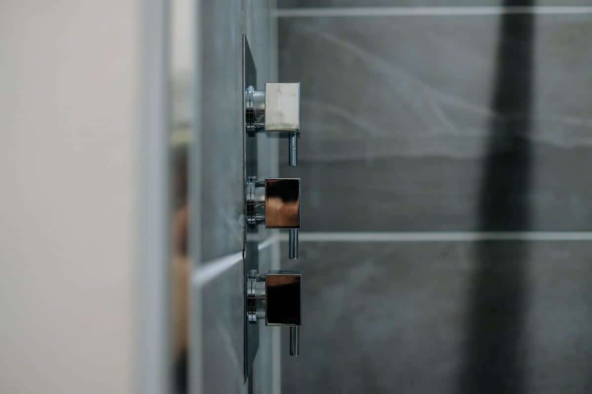 A metallic structure with three square elements, possibly part of a larger installation or equipment.