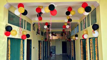Stunning hotel corridor with a chandelier and vibrant decor.