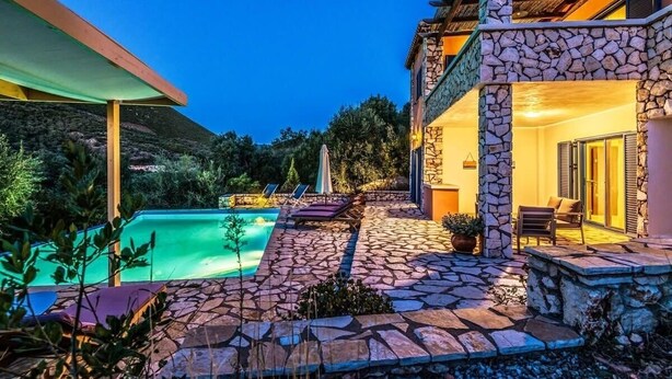A poolside area with stone flooring, lounge chairs, and a covered seating area. - Villa Eleanor, Sivota Lefkada - 13 minute walk to the Bay.
Stunning Sea views. (Sivota Bay)