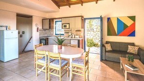 A modern kitchen with a dining area, a sofa, and a colorful abstract painting. - Villa Eleanor, Sivota Lefkada - 13 minute walk to the Bay.
Stunning Sea views. (Sivota Bay)