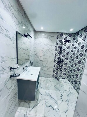 Shower, towels, soap, toilet paper