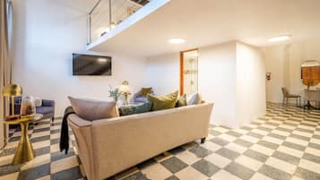 Loft, 1 Bedroom, Balcony | Living area | 45-inch LED TV with digital channels